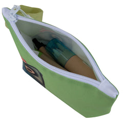 Green toiletry bag with white zipper containing cosmetic items on a white background